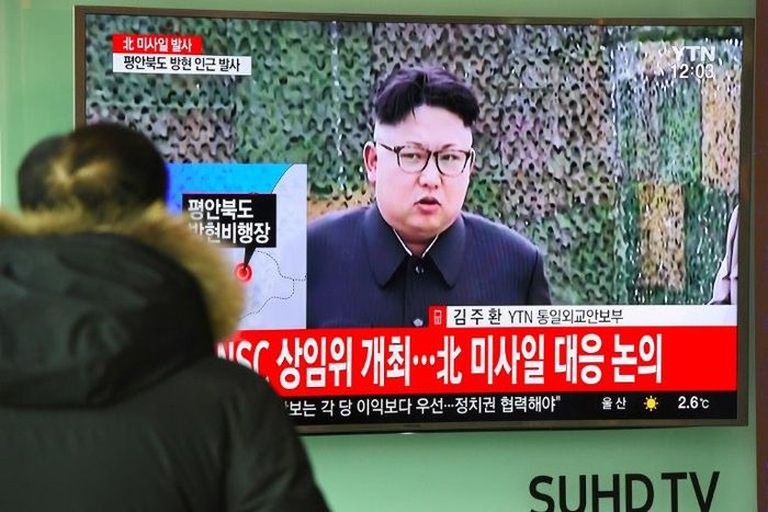 A man watches the news showing file footage of North Korean leader Kim Jong-Un at a railway station in Seoul on February 12, 2017