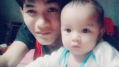 Wuttisan Wongtalay and the infant.