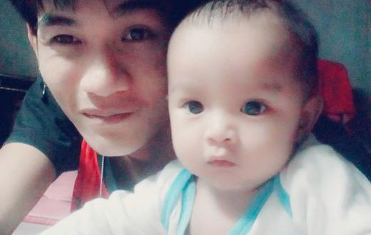 Wuttisan Wongtalay and the infant.