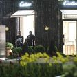 Police officers stand guard in front of the Cartier jewellery boutique after it was robbed in downtown Monaco