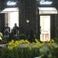 Police officers stand guard in front of the Cartier jewellery boutique after it was robbed in downtown Monaco