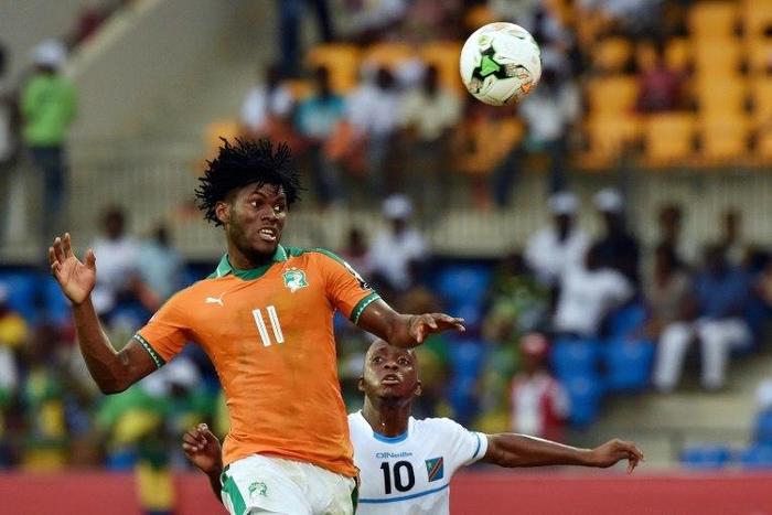 DR Congo's Neeskens Kebano (back) challenges Ivory Coast's Franck Kessie in Oyem on January 20, 2017
