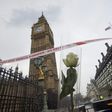 A flower left in tribute to the victims of the London March 22 terror attack placed next to the Palace of Westminster