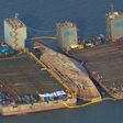 The damaged Sewol ferry was held afloat between two barges during a salvage operation off the South Korean island of Jindo, on March 23, 2017