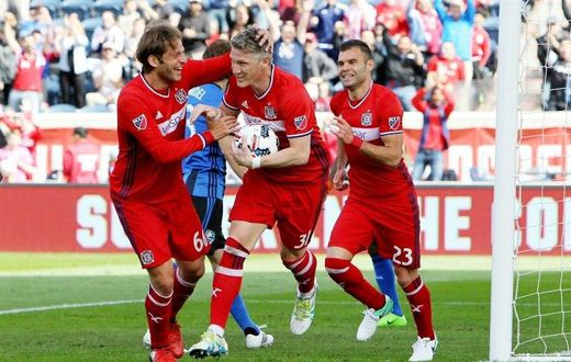 Bastian Schweinsteiger (C) of Chicago Fire celebrates after scoring a goal in the first half during their MLS match against the Montreal Impact, at Toyota Park in Bridgeview, Illinois, on April 1, 2017