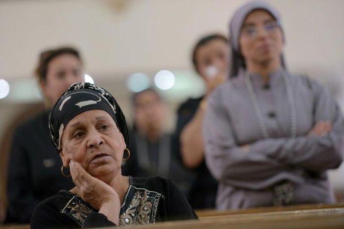 Egyptians attend mass at St Mark's Coptic Orthodox Cathedral in Bani Mazar on May 27, 2017 a day after the bus massacre