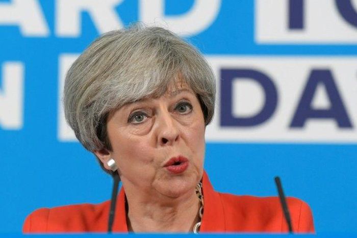 Britain's Prime Minister Theresa May was accused of backpedaling on a key campaign pledge