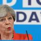 Britain's Prime Minister Theresa May was accused of backpedaling on a key campaign pledge