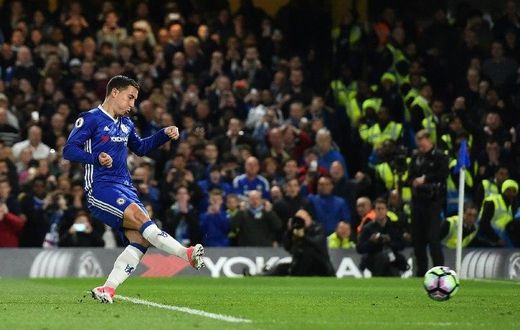 Chelsea's midfielder Eden Hazard scores his team's second goal during the English Premier League football match between Chelsea and Manchester City at Stamford Bridge in London on April 5, 2017