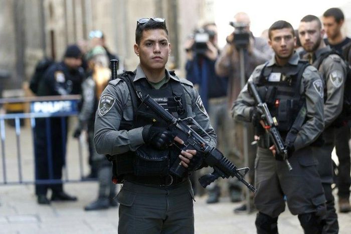 Israeli security forces stand guard at a street in Jerusalem's Old City following a previous stabbing attack on April 1, 2017