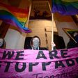People hold up a banner during a rally in Trg Zrtava Fasizma Square in downtown Zagreb on February 13, 2017, to protest against violence against the LGBT population in Croatia