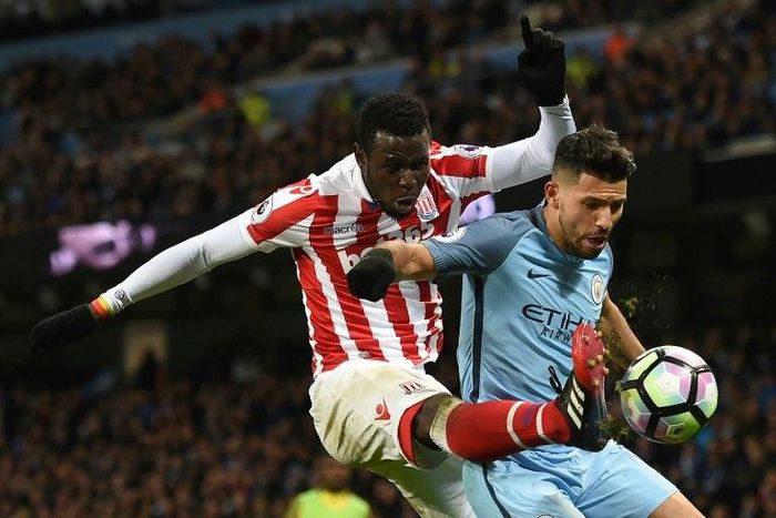 Stoke City's striker Mame Biram Diouf (L) vies with Manchester City's striker Sergio Aguero during a English Premier League football match at the Etihad Stadium in Manchester, north west England, on March 8, 2017