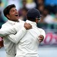 India's Kuldeep Yadav (L) celebrates the wicket of Australia's Peter Handscomb with teammate Murali Vijay during the fourth Test at The Himachal Pradesh Cricket Association Stadium in Dharamsala on March 25, 2017