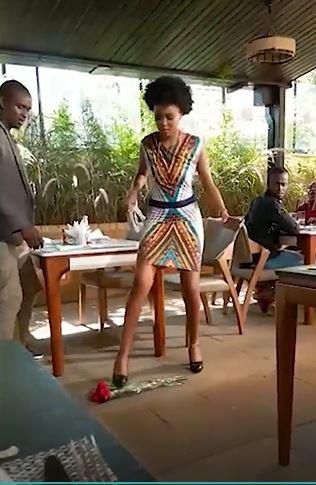Lady steps on flowers (Courtesy)