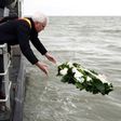 West-Flanders province governor Carl Decaluwe throws a wreath to the sea during a tribute ceremony for the 30th anniversary of the Herald of Free Enterprise ferry disaster