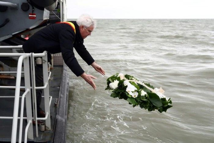 West-Flanders province governor Carl Decaluwe throws a wreath to the sea during a tribute ceremony for the 30th anniversary of the Herald of Free Enterprise ferry disaster