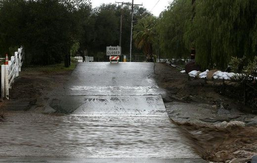 A road is blocked off due to floodwaters on January 23, 2017 in Santa Clarita, California