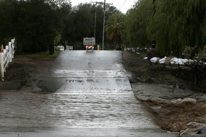 A road is blocked off due to floodwaters on January 23, 2017 in Santa Clarita, California