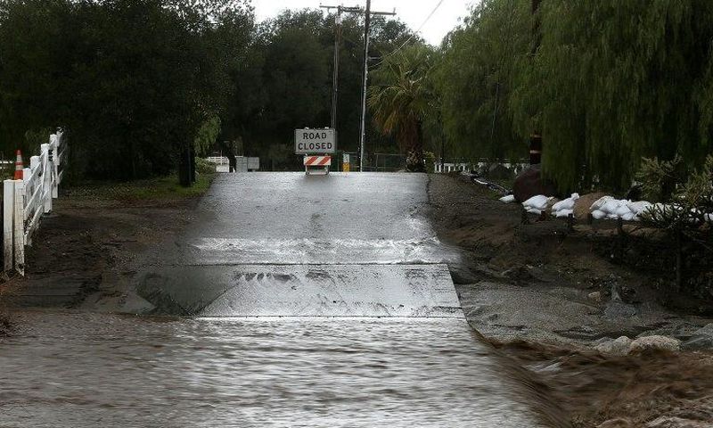 A road is blocked off due to floodwaters on January 23, 2017 in Santa Clarita, California