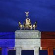 Germany's Brandenburg Gate lit up in the French national colours after Islamic extremists went on the rampage in Paris, killing 130 people
