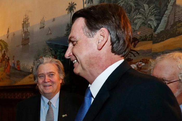 Brazilian President Jair Bolsonaro (R) and US President Donald Trump's former strategist Stephen Bannon during a meeting Sunday with prominent conservative thinkers at the Brazil embassy in Washington