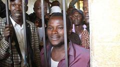 Julius Mwithalii (right) at the Maua Law Courts cells after appearing before Senior Resident Magistrate Antony Munene where he was charged with attempted suicide.