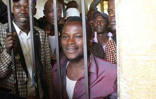 Julius Mwithalii (right) at the Maua Law Courts cells after appearing before Senior Resident Magistrate Antony Munene where he was charged with attempted suicide.