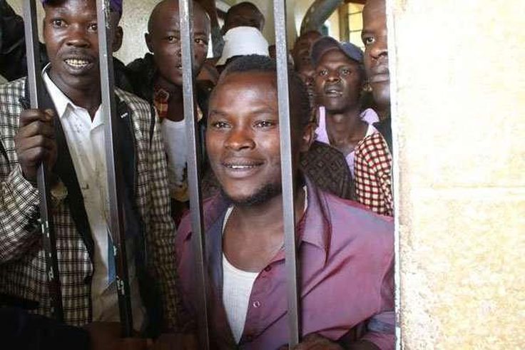 Julius Mwithalii (right) at the Maua Law Courts cells after appearing before Senior Resident Magistrate Antony Munene where he was charged with attempted suicide.