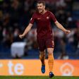 Roma's forward Edin Dzeko celebrates after scoring against Sassuolo at the Olympic Stadium in Rome on March 19, 2017