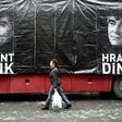 A banner shows late Turkish-Armenian journalist Hrant Dink in front of the offices of Armenian weekly newspaper "Agos" at a rally to commemorate the ten-year anniversary of his assassination, in Istanbul, on January 19, 2017