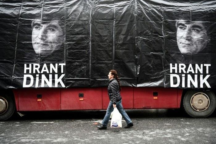 A banner shows late Turkish-Armenian journalist Hrant Dink in front of the offices of Armenian weekly newspaper "Agos" at a rally to commemorate the ten-year anniversary of his assassination, in Istanbul, on January 19, 2017