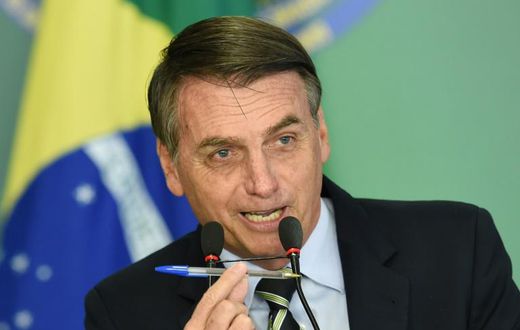 Brazilian President Jair Bolsonaro before signing a decree that makes it easier for adults with no criminal records to buy guns and keep them at home