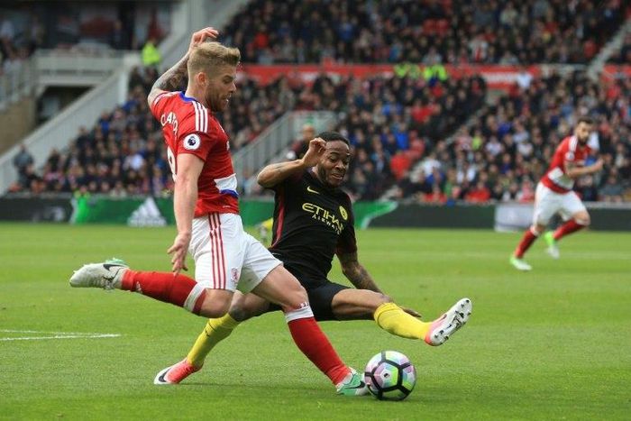 Middlesbrough midfielder Adam Clayton (left) vies with Manchester City's Raheem Sterling during their English Premier League match at Riverside Stadium in Middlesbrough on April 30, 2017