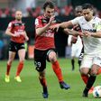 Monaco's forward Radamel Falcao (R) outruns Guingamp's midfielder Christophe Kerbrat during the French L1 football match February 25, 2017