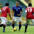 Malaysia's Mahalli Jasuli (C) is faced by Yemen players during the Asian Cup 2015 qualifying match in Shah Alam Stadium near Kuala Lumpur on March 22, 2013