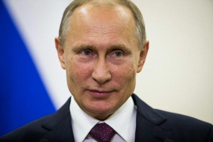 Russian President Vladimir Putin delivers a statement on his departure from Berlin's Tegel airport on October 20, 2016