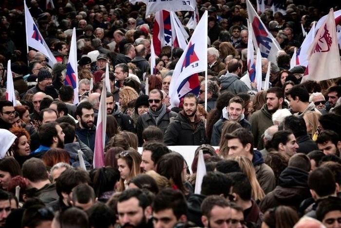 Hundreds of people gather before taking part in a protest march marking a 24-hours general strike in Athens on December 8, 2016