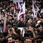 Hundreds of people gather before taking part in a protest march marking a 24-hours general strike in Athens on December 8, 2016