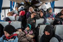 Women and children fleeing the last area controlled by ISIS jam into a bus to reach camps controlled by Kurdish Syrian militias.CreditIvor Prickett for The New York Times