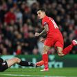 Liverpool's midfielder Philippe Coutinho (R) watches hsi shot beat Bournemouth's Polish goalkeeper Artur Boruc during the English Premier League football match between Liverpool and Bournemouth at Anfield in Liverpool, on April 5, 2017
