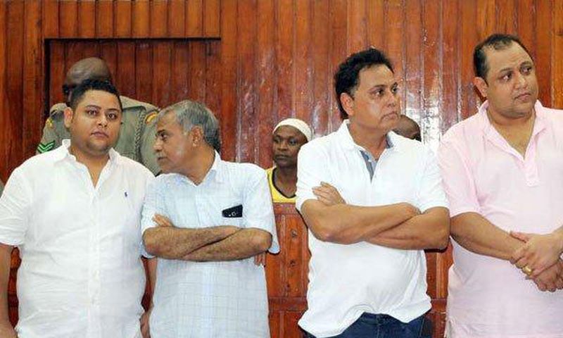 From left, Ibrahim Akasha Abdalla, Gulam Hussein, Vijaygiri Anandgiri Goswami and Baktash Akasha Abdalla follow proceedings in their case on December 13, 2016.