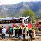 Emergency personnel stand before the righted bus on the Spanish AP-7 motorway following a fatal accident that claimed the lives of 13 foreign students an injured 44 others on March 20, 2016