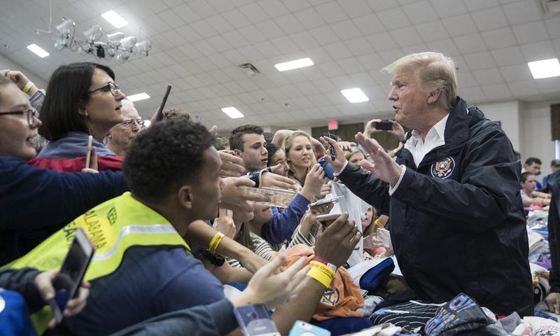 Trump Surveys Tornado Damage in Alabama, and Signs Some Bibles, Too