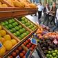 A fruit vendor tends to his stall in Sydney's central business district on November 29, 2016