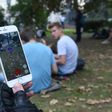 Hunting Pokemon at a park in Russia, where a blogger is on trial for posting a video of him playing the game in a church