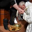 This handout picture released by the Vatican press office shows Pope Francis washing the feet of inmates at the Paliano prison outside Rome on April 13, 2017 during the Holy Thursday celebrations