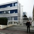 A security guard stands in front of the French far-right Front National headquarters in Nanterre on February 20, 2017