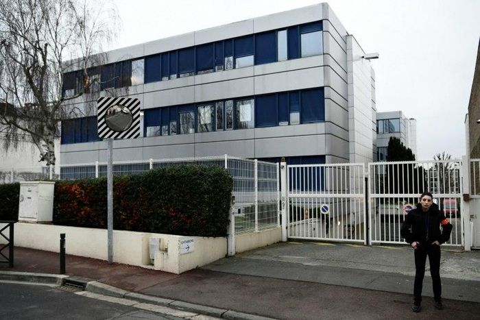 A security guard stands in front of the French far-right Front National headquarters in Nanterre on February 20, 2017