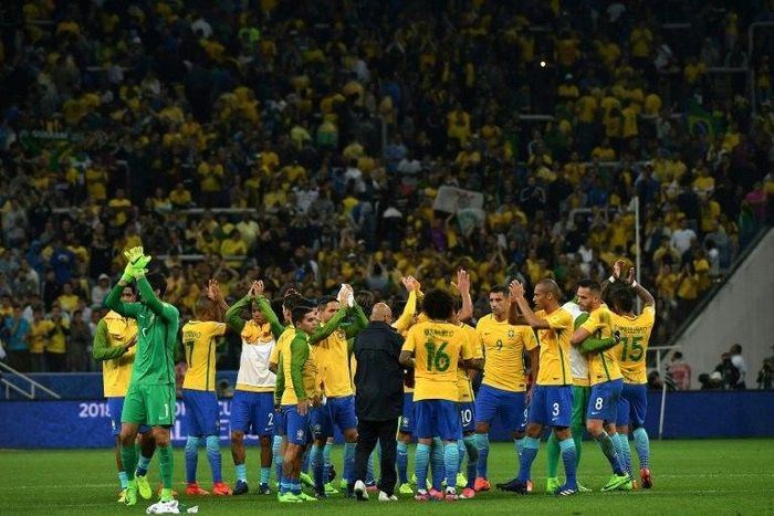 Brazilian players celebrate at the end of their 2018 FIFA World Cup qualifier football match against Paraguay in Sao Paulo, Brazil on March 28, 2017