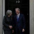 British Prime Minister Theresa May shakes hands with her Italian counterpart Paolo Gentiloni outside No. 10 Downing Street in London, on February 9, 2017